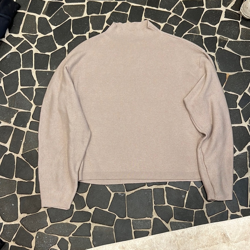 I am selling this sweater because it’s just sitting in my closet going to waste